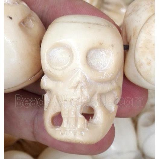 antique cattle bone beads, skull, yellow