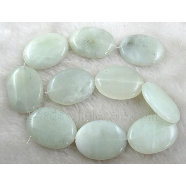 Flat oval jade bead
