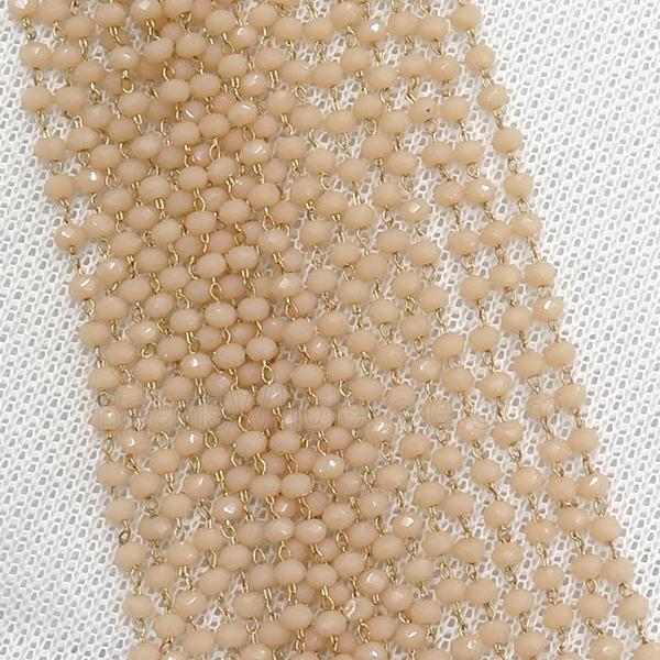 raw brass chain with peach crystal glass