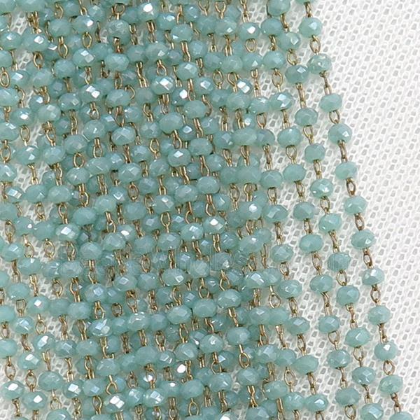 raw brass chain with blue crystal glass