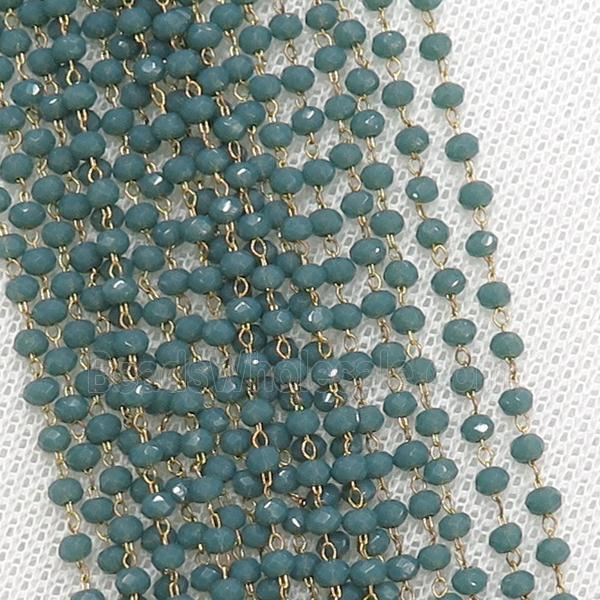 raw brass chain with green crystal glass