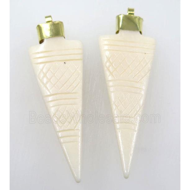 white cattle bone pendant, arrowhead
