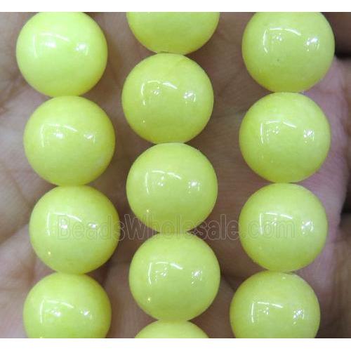 yellow jade bead, round, stabile